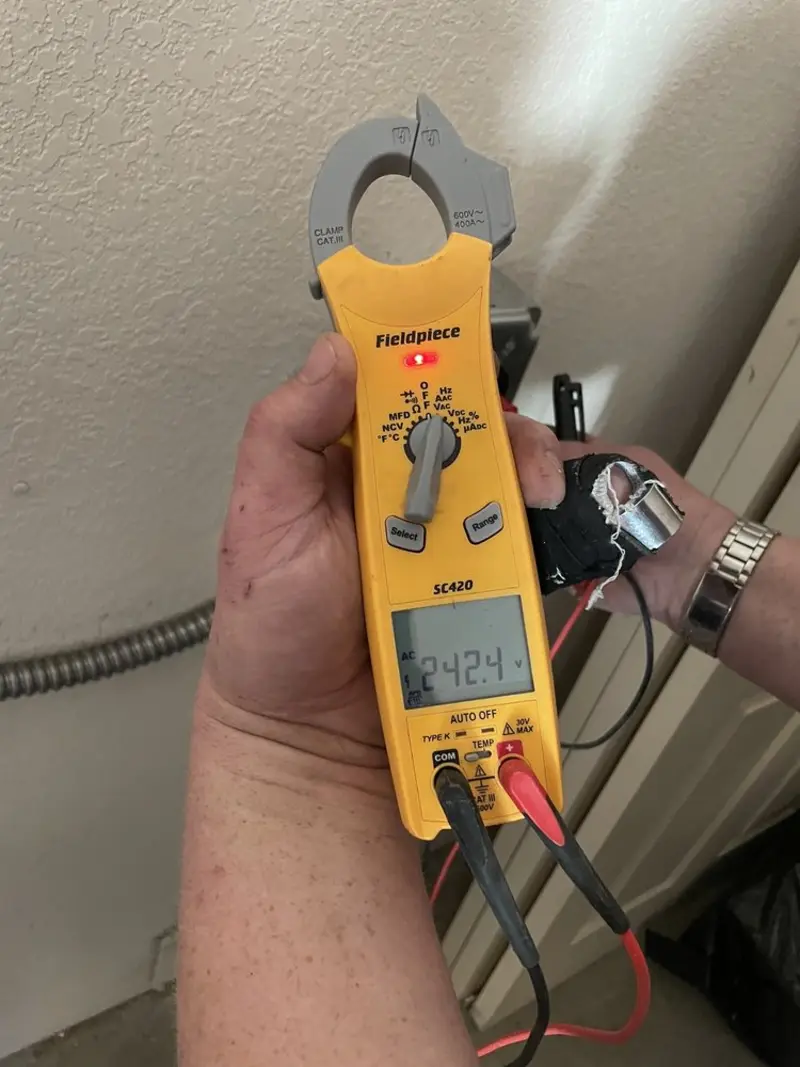 Voltage testing with clamp meter during Circuit Breaker Repair in Akron